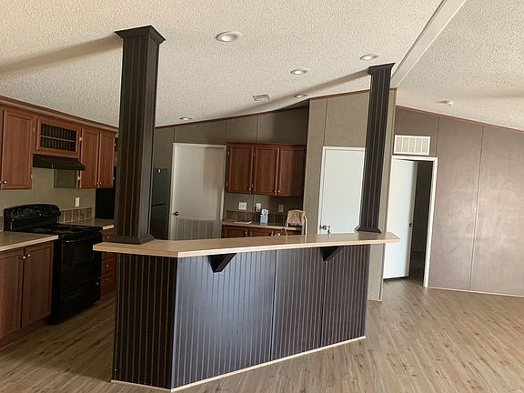 Standing in dining area, looking at kitchen