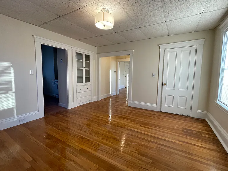 Dining room with built in hutch, kitchen entrance to the left
