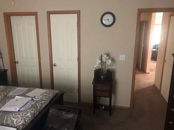 Master bedroom with the door on right (bathroom), middle door (Close) and door on left (hallway).