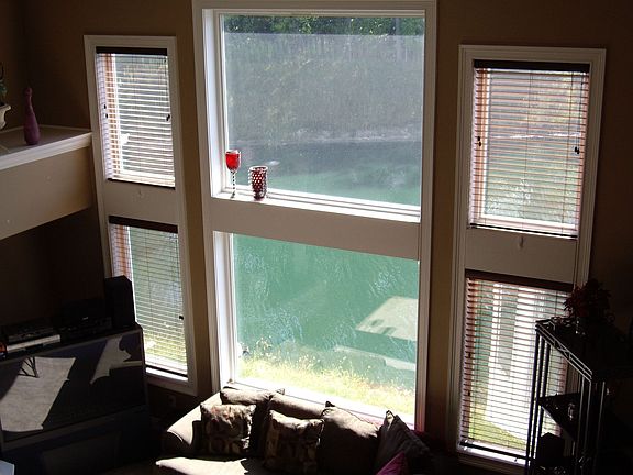Two story great room with pond view & woods