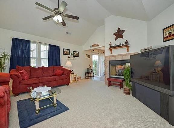 Spacious Living Room includes fireplace with gas logs