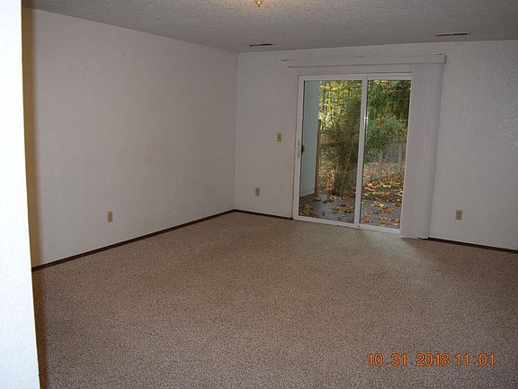 Living room with patio door to deck.
