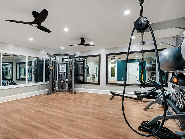 Suites Building fitness center with strength equipment