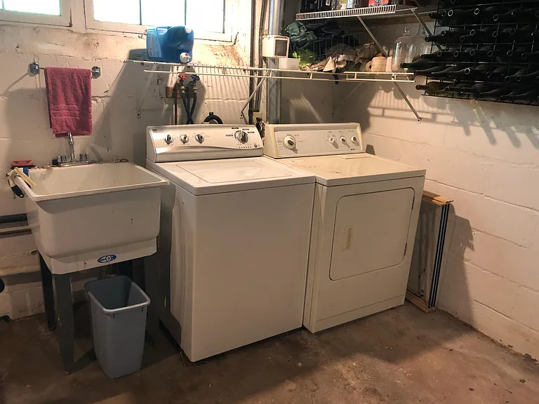Free separate washer & dryer with laundry sink in basement. Extra storage space in this basement room as well.
