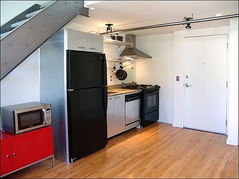 Kitchen has granite counters, stainless appliances and gas stove