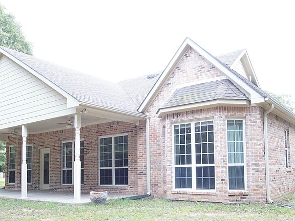 Behind back bedroom/side