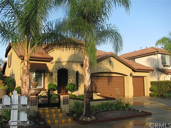 3 Car garage, Spanish courtyard and low maintenance landscaping.