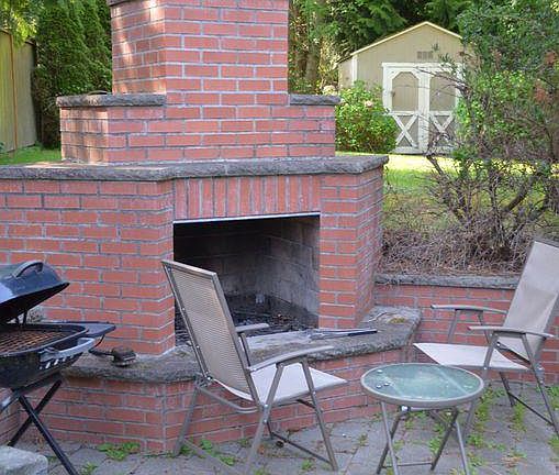Backyard that's great for entertainment with a fireplace and