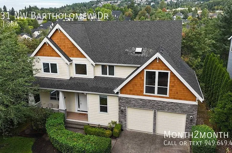9831 NW Bartholomew Dr — Photo 38