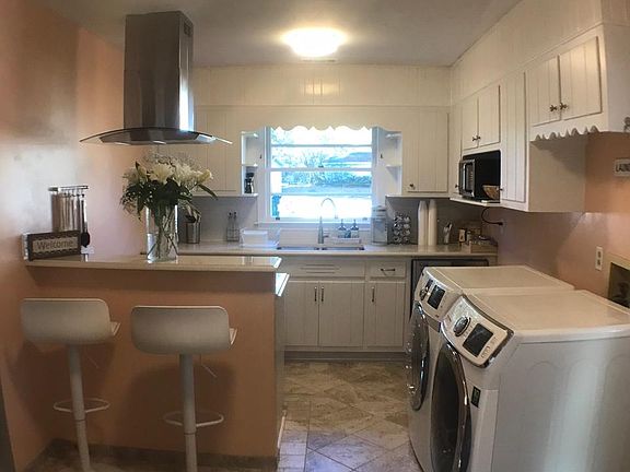 Kitchen with exhaust hood and bar counter