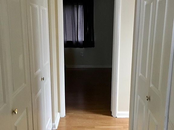 Upstairs hallway. Closet on left, washer/dryer on right. Bedrooms on either end.
