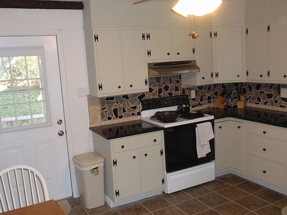 Kitchen: Granite Counters, Ceramic Tile Floor, Mosaic granite & tile backsplas