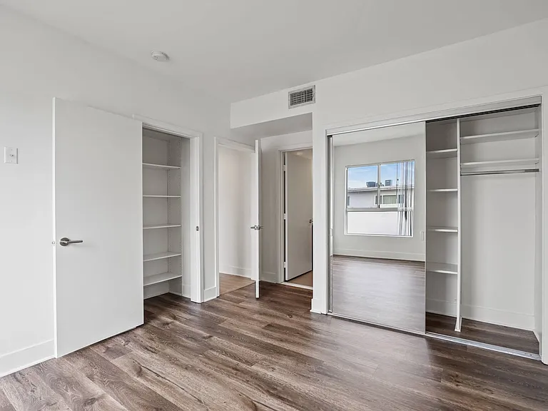 Bedroom with Two Closets with Shelves