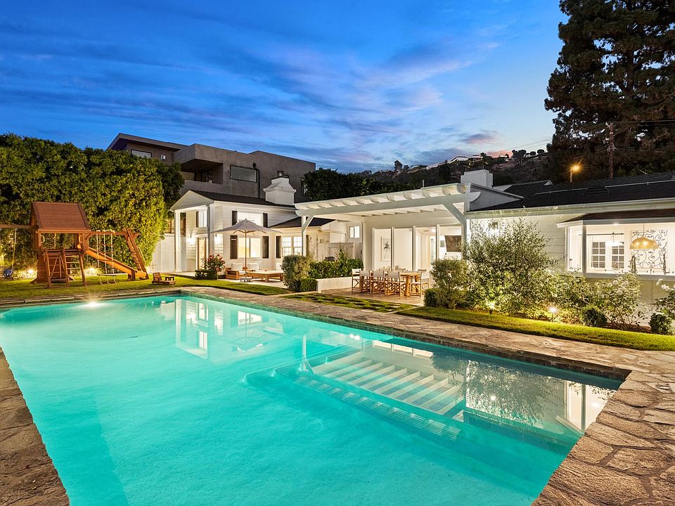 Twilight magic at our stunning pool_your Beverly Hills retreat awaits.