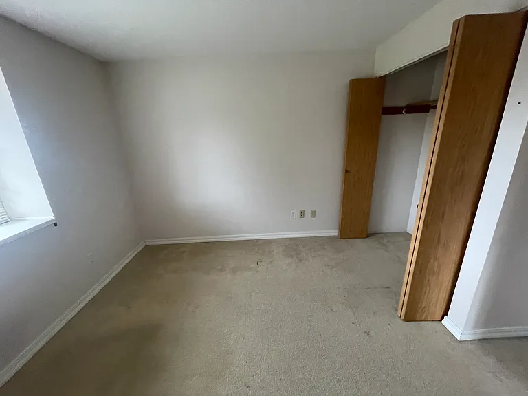 Bedroom 3 with window to the street - the corner of the window can be seen 
on the left side of the picture