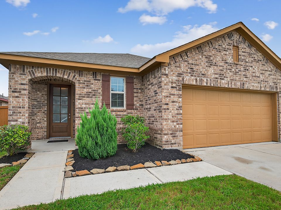Front Exterior Beautiful brick exterior with fresh landscaping, a covered entryway, and a welcoming front porch.