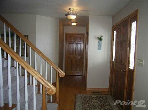 Foyer Open to Formal Living Room and Mud Room