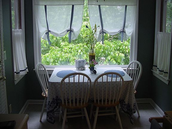 Breakfast area has access to screened porch.