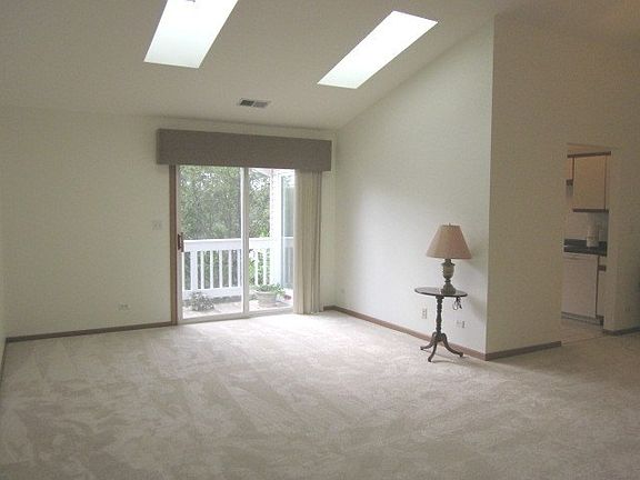 Skylights & access to Balcony with Peaceful Wooded views