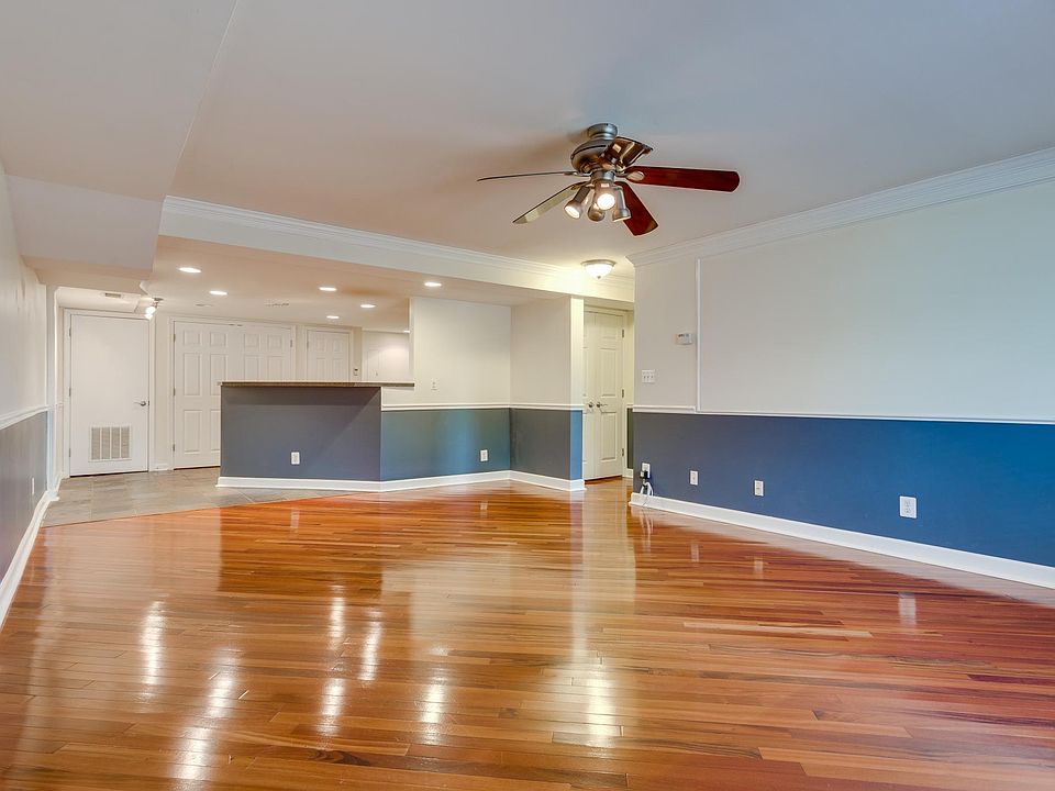 Large living area with hardwood floors
