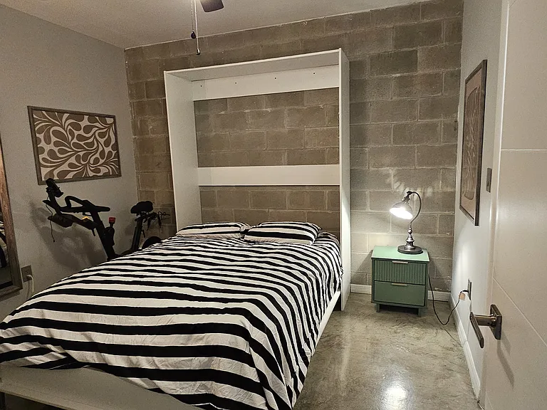 Second bedroom with murphy bed pulled down.