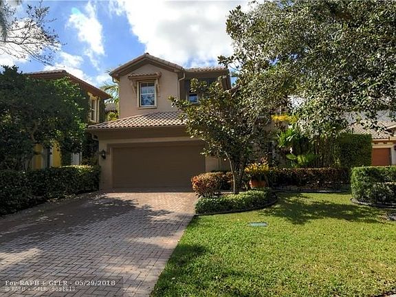 Beautifully landscaped front of property.