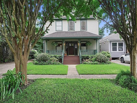 Beautiful trees frame this home along with the beautiful lush backyard!