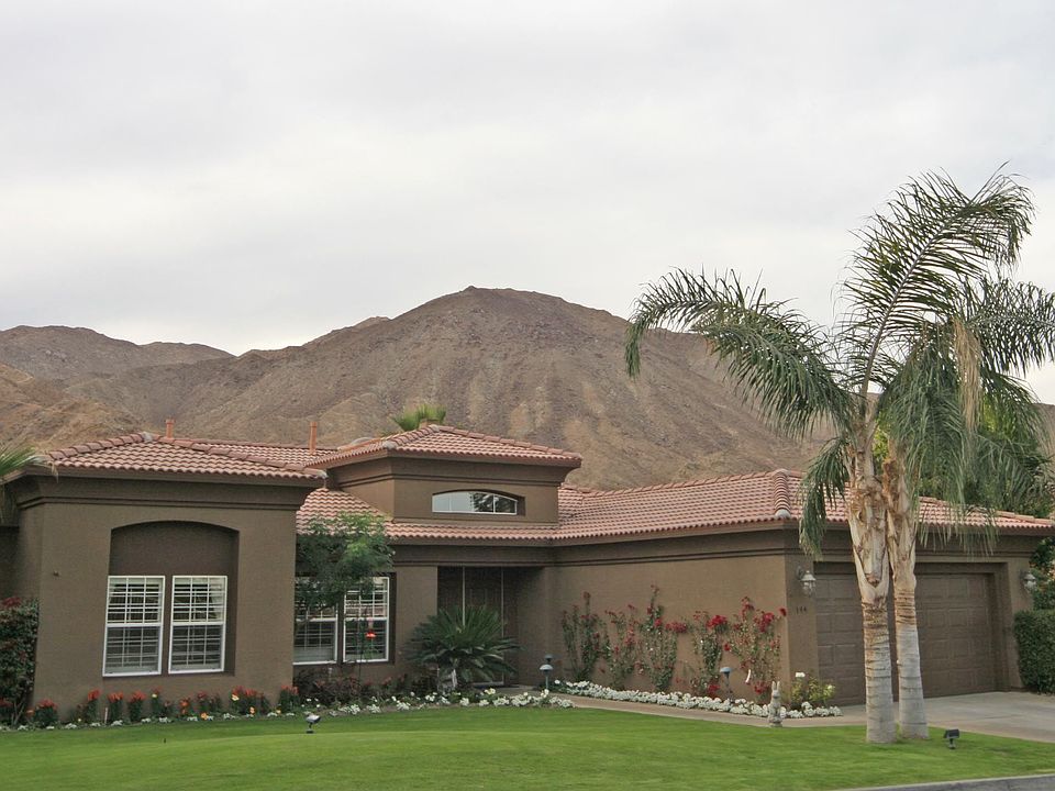 The Front of the Home, with Mountains in the Background
