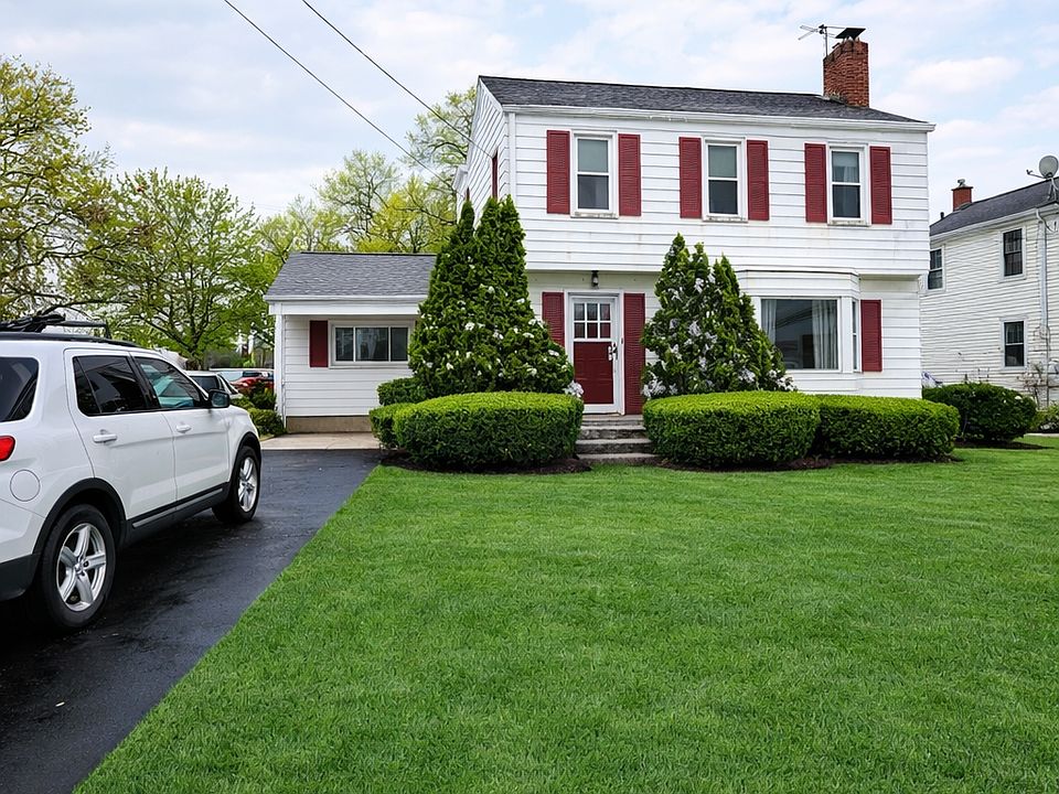 Front of house with driveway parking