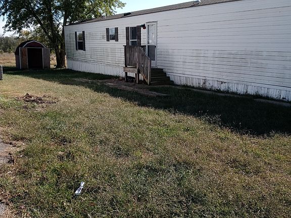 front of the home and shed