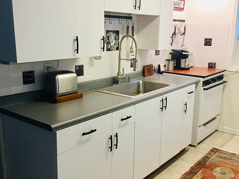 Kitchen with updated sink, faucet and door hardware. 
10'x7'11"