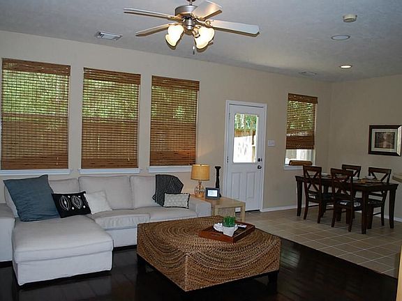 Wall of gorgeous windows is only out done by the gleaming hardwood floors! Fantastic upgrades in thi