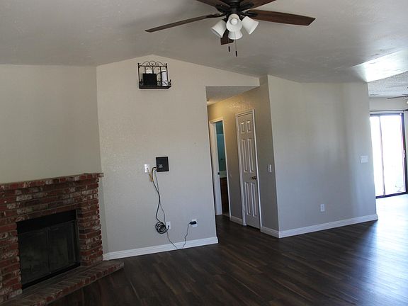Living room, opening up to the main hallway, dining room, and kitchen to the right.