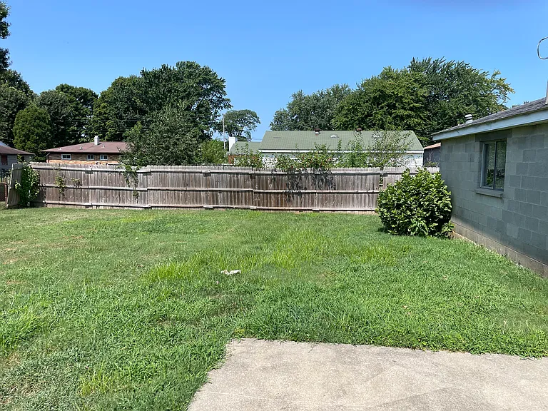 Large back yard with fence