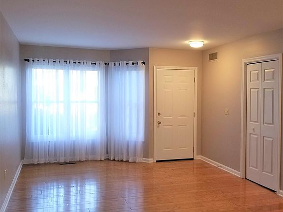 First floor, looking towards front door (facing street). Coat closet to the right.