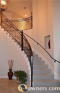 Circular staircase with wrought-iron rail