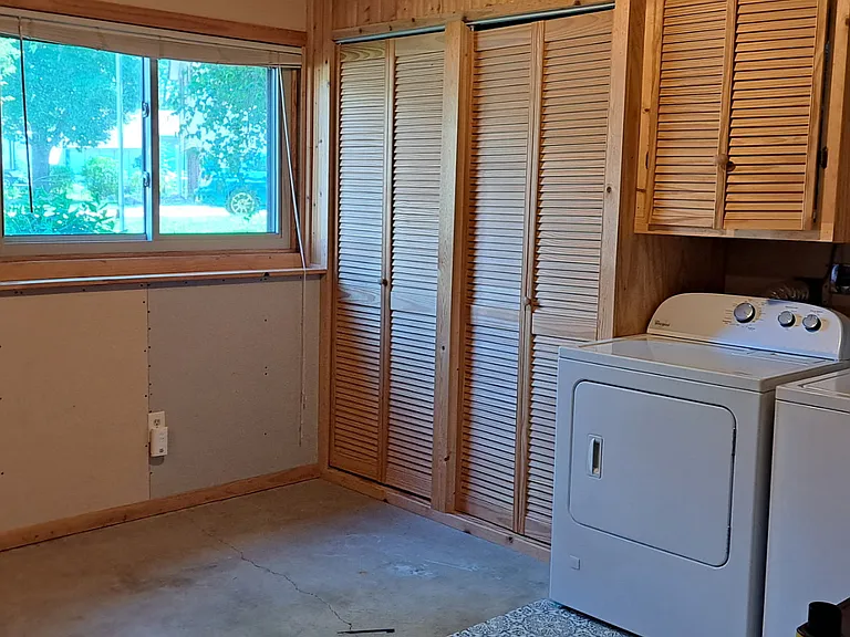 laundry room with ample storage