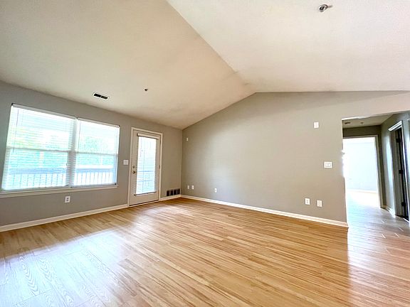 Main living area with vaulted ceiling