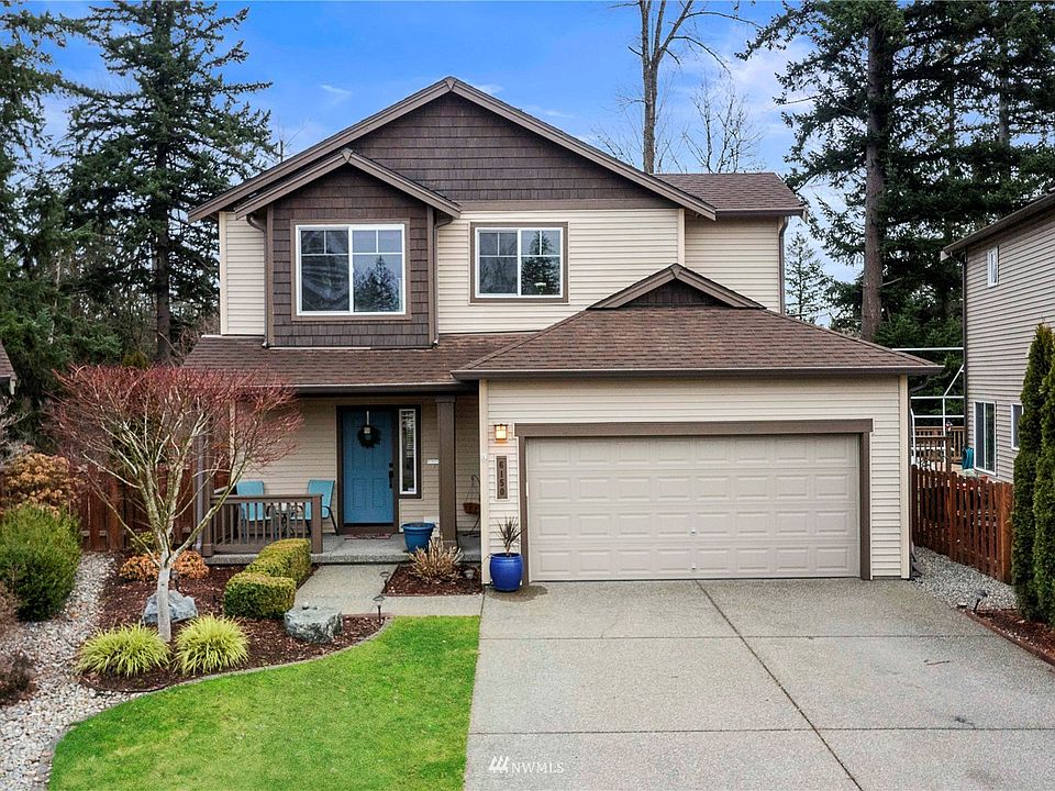 Welcome home to this immaculate Lakeland Hills home perfectly situated on greenbelt lot