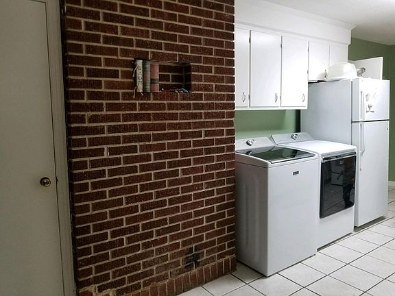 Room for side by side washer./dryer. Must provide own refrig