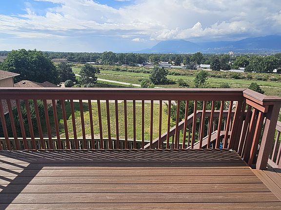 Private deck attached to living room via sliding glass door