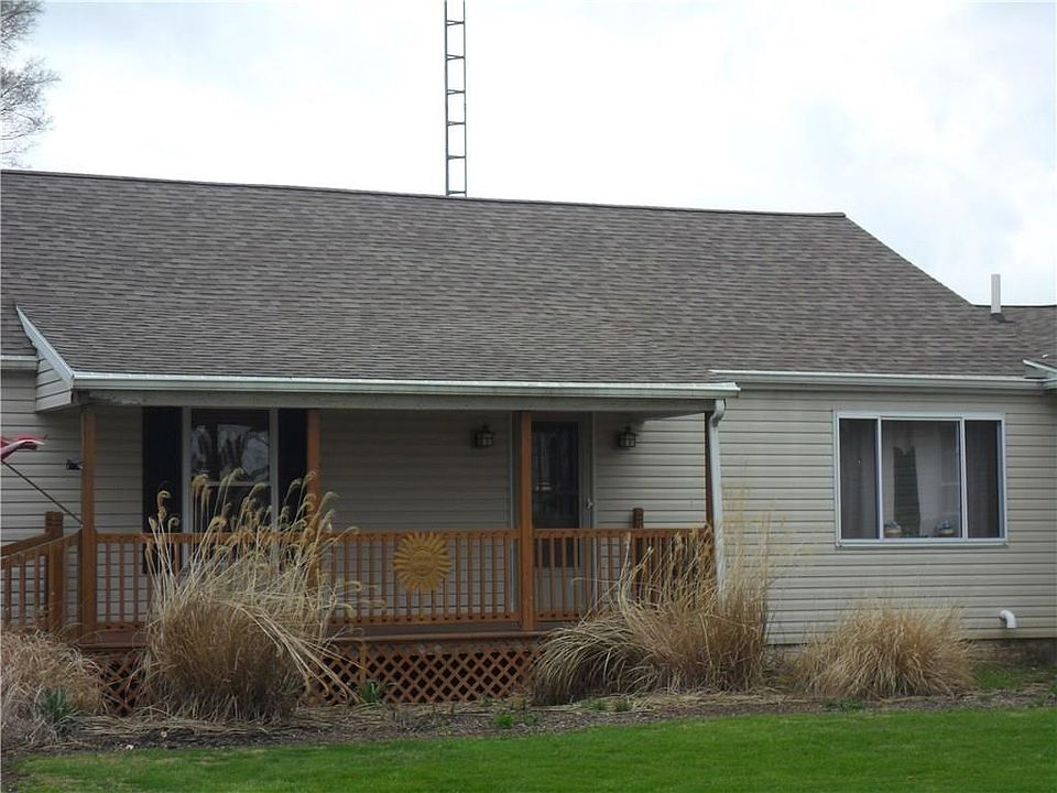 Nice front porch on this property 30 year roof is newer.