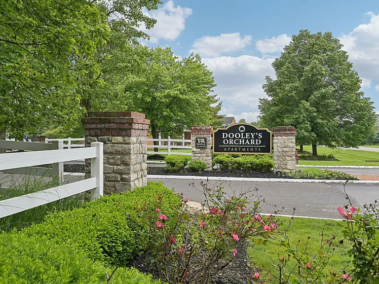 Dooley's Orchard Apartment Homes entrance sign.