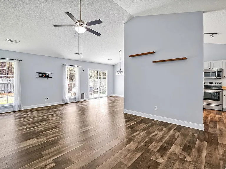 Living room with view of kitchen and dining room