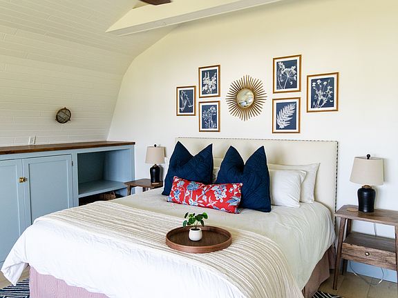 The master room includes a king size bed, built-in closet space, a dresser, a desk, and a smart TV