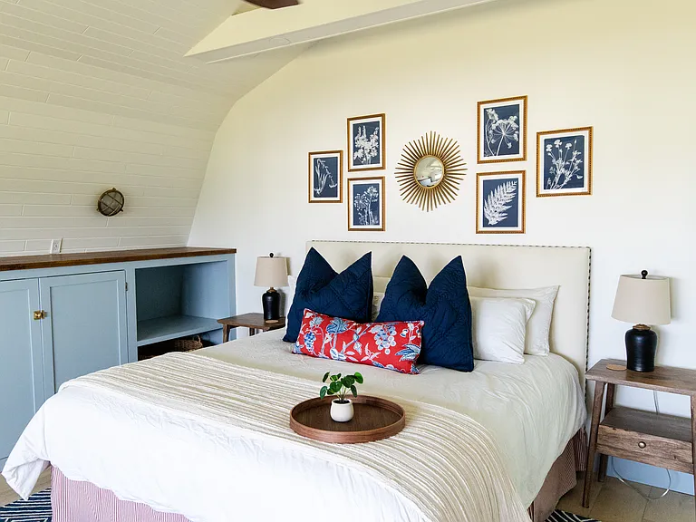 The master room includes a king size bed, built-in closet space, a dresser, a desk, and a smart TV