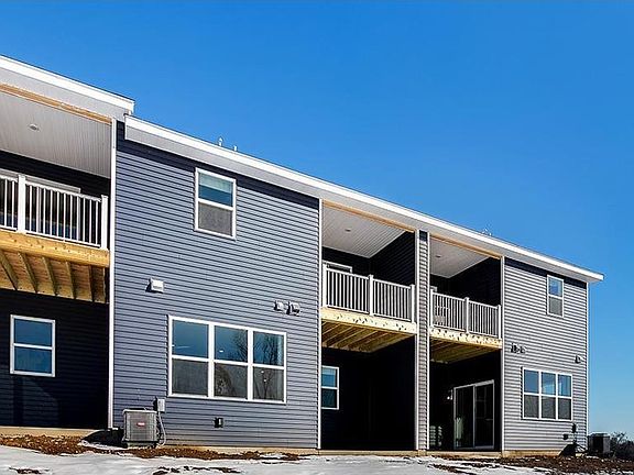 Balcony off the primary bedroom and the covered patio below off the dining area.