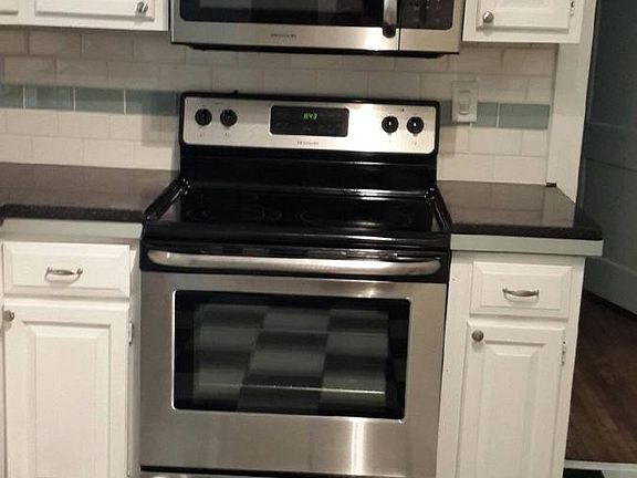 New SS appliances look great with black and white tile floors. This kitchen does not disappoint, it is large!