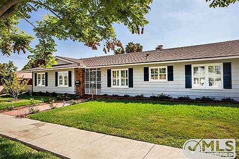 Cape Code New England 3/4 front view of this beautifully maintained residence.