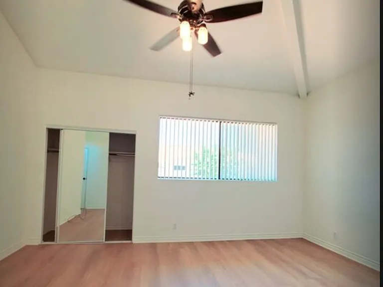 Primary bedroom with ceiling fan